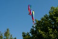 Colorful windsocks in a garden at a flagpole Royalty Free Stock Photo