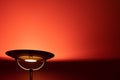 Metal floor lamp lighting red wall. Royalty Free Stock Photo