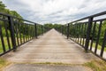 Metal footbridge over the river. Pedestrian crossing over a gorge in Central Europe Royalty Free Stock Photo