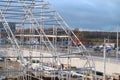 November 6, 2020, Moscow.The metal frame of the pavilion under construction against the background of a highway with heavy traffic