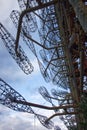 Metal frameworks with extensive wiring under an overcast sky. Duga is a Soviet over-the-horizon radar station for an early