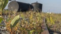 A metal fuel tank in an antique railway yard. Old black Fuel Tank on the village railroad station