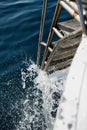 Metal gangway boat in sea water Royalty Free Stock Photo