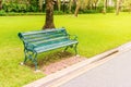 Metal garden chair on green grass, Chairs on the lawn in the park, The chair in the park on grass. Royalty Free Stock Photo