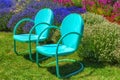 Metal Garden Chairs in a Garden Royalty Free Stock Photo