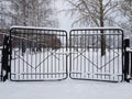 Metal gate covered with snow Royalty Free Stock Photo