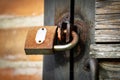 Metal gate protect and locked with old rusty padlock Royalty Free Stock Photo