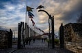 Metal gate and a row of flags on a gloomy trail in Budapest