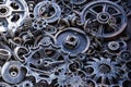 Metal gears background. Old and rusty spare parts for industrial machines in a landfill. Royalty Free Stock Photo