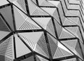 Metal geometric angular cladding with perforated design Royalty Free Stock Photo
