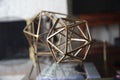 Metal geometric tabletop home decoration. Polyhedron shape decorative interior element