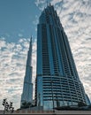 Metal glass and concrete giant massive of Burj Khalifa and the neighbour building