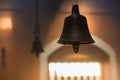 Metal golden bell in a buddhist temple with light. Royalty Free Stock Photo