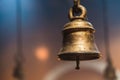 Metal golden bell in a buddhist temple with light. Royalty Free Stock Photo