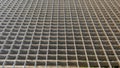 Metal grate floor with rectangular cells, perspective view. Horizontal background. Royalty Free Stock Photo