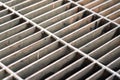 Metal grate structure of drainage waterway. Royalty Free Stock Photo