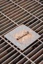 Metal grate structure of drainage waterway. Royalty Free Stock Photo