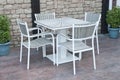 Metal and gray wood outdoor patio furniture for dining Royalty Free Stock Photo