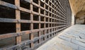 Metal grid gate in historic building corridor with stone pavement Royalty Free Stock Photo