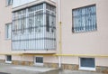 Metal grid for windows and balcony protection. House balcony window with iron security bars.