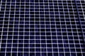 Metal grid texture in blue tone. Royalty Free Stock Photo
