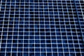 Metal grid texture in navy blue tone. Royalty Free Stock Photo