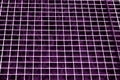 Metal grid texture in purple tone. Royalty Free Stock Photo