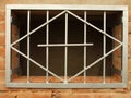 Metal grid in the window Royalty Free Stock Photo