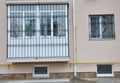 Metal grid for window and balcony protection. Houseflat balcony window with iron security bars