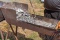 Metal grill with smoldering coals for frying meat or vegetables in the open air.