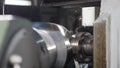 Metal grinding machine with sparks and swarfs in slow motion. Industrial concept grinding metal with sharp sparks