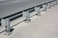 Metal guardrail on an asphalt bridge Royalty Free Stock Photo