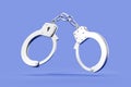 Metal handcuffs for arresting or detaining, blue background