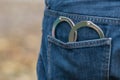 Metal handcuffs in back jeans pocket