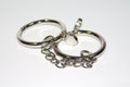 Metal handcuffs on the white background