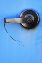 Metal Handle on Blue Metal Door with Lock for Security Scratch Mark Royalty Free Stock Photo