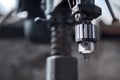 Metal head drilling machine. Image is tinted Royalty Free Stock Photo