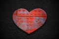 Metal heart on a dark texture Royalty Free Stock Photo
