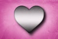 Metal heart shape on pink concrete wall background . 3D rendering Royalty Free Stock Photo