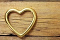 Metal hearts in old wooden background