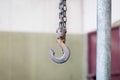 Metal hook hanging on chain Royalty Free Stock Photo