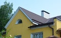 Metal house roof with guttering andsnow board protection