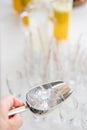 A metal ice bucket with full of crushed ice and stainless scoop for dessert on table in hotel. Royalty Free Stock Photo