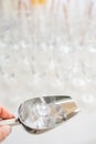 A metal ice bucket with full of crushed ice and stainless scoop for dessert on table in hotel. Royalty Free Stock Photo