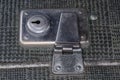 Metal inbuilt lock of the old hardshell suitcase close-up Royalty Free Stock Photo