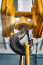 Metal industrial chains with hooks in the workshop of a metallurgical plant. Close-up. Lifting hooks for lifting heavy materials Royalty Free Stock Photo