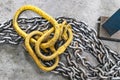 Metal industrial chains with hooks in the workshop of a metallurgical plant. Close-up. Lifting hooks for lifting heavy materials Royalty Free Stock Photo