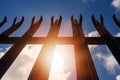 Metal industrial security fence with spikes on top against blue sky background. Royalty Free Stock Photo