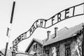 Metal inscription Arbeit macht frei on the main entrance gate to Oswiecim concentration camp, Poland Royalty Free Stock Photo