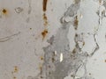 The metal iron surface of the sheet is old shabby shabby with rust and painted with gray paint. The background. Texture Royalty Free Stock Photo